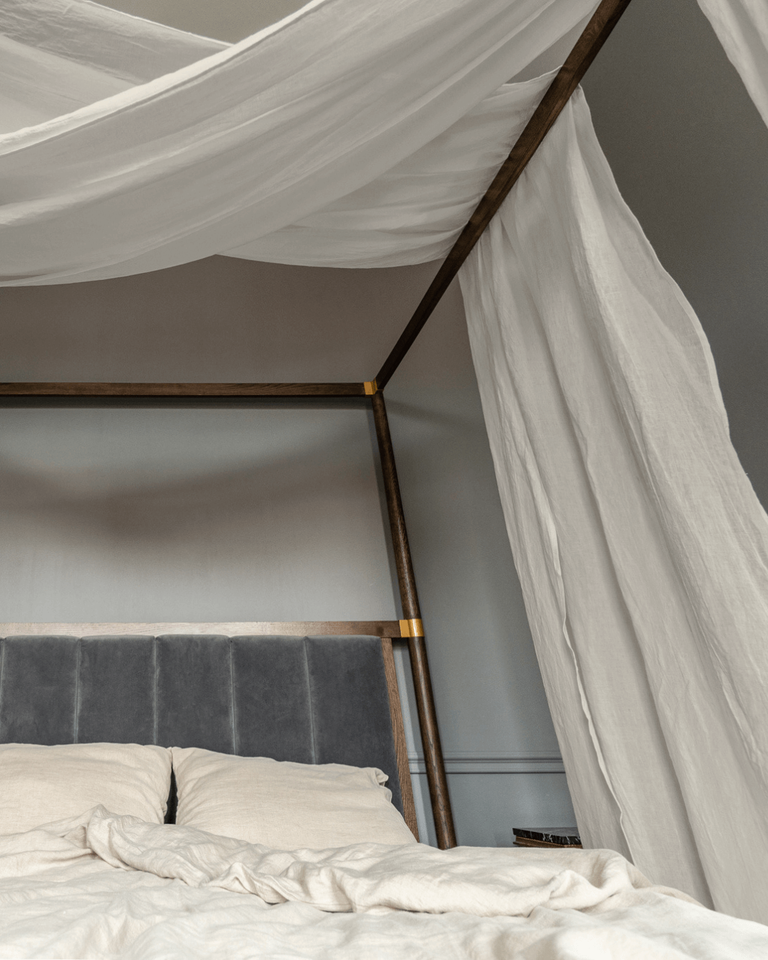 a bed with a white canopy over it