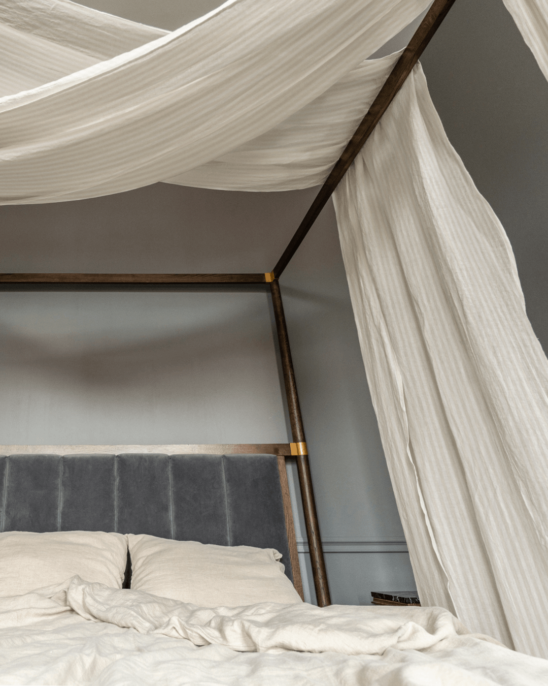 a bed with a white canopy over it
