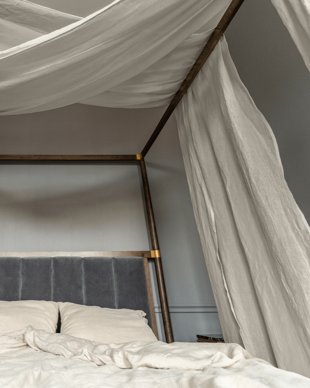 a bed with a white canopy over it