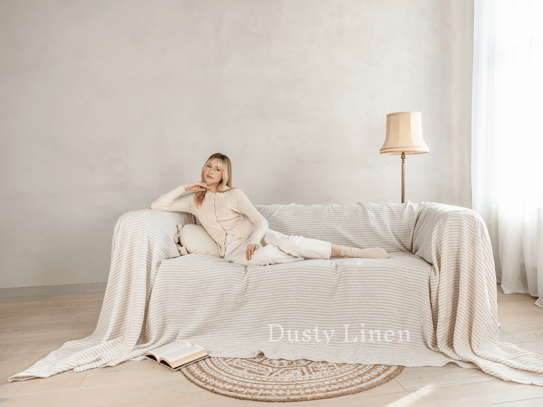 Linen couch cover draped on sofa, loose fit natural tone, custom size