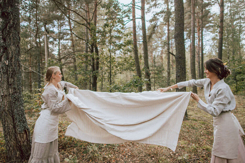 Linen fabric after washing showing natural relaxed texture, shrinkage guide