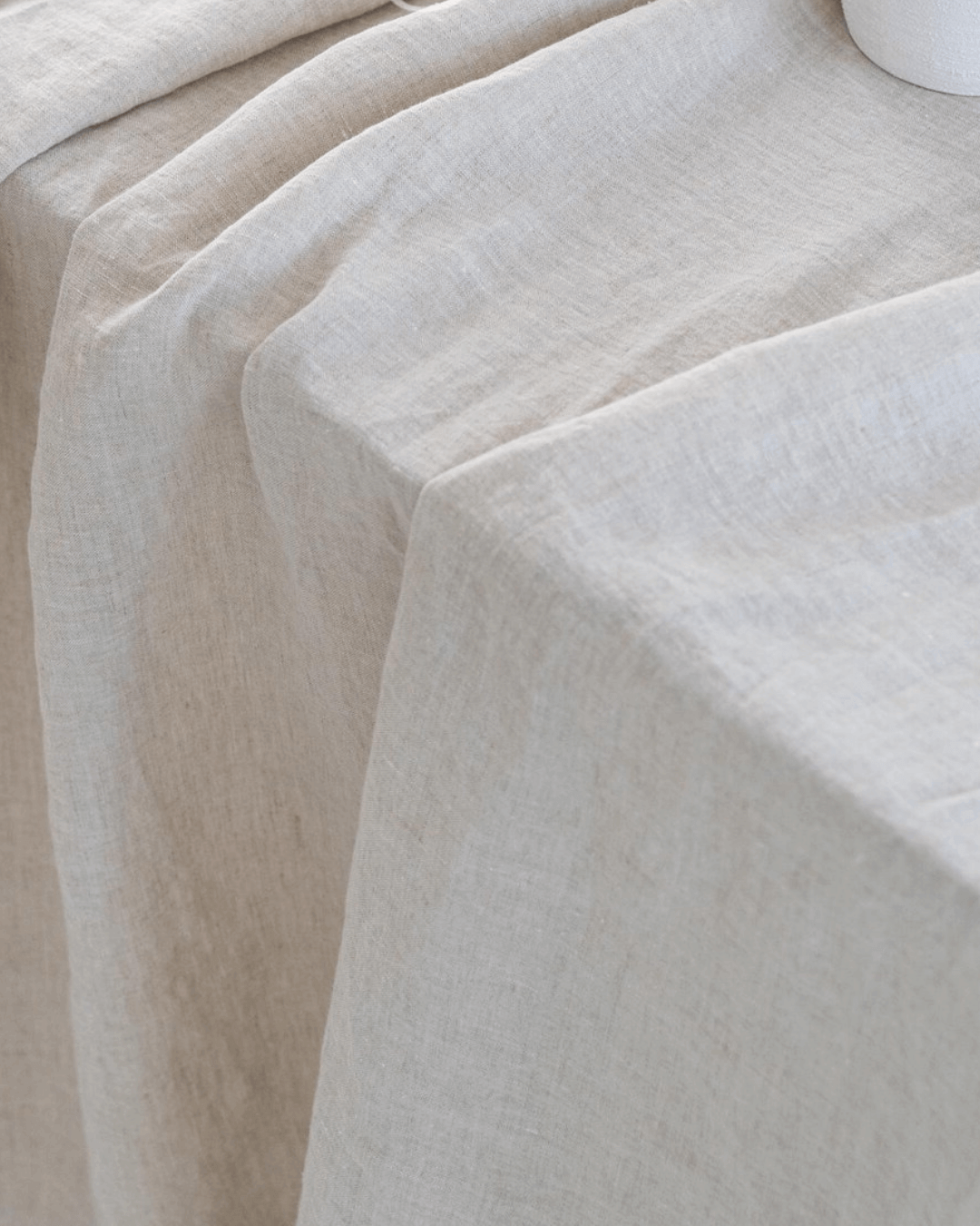 Natural light linen fabric close-up, softened 190 g/m² texture