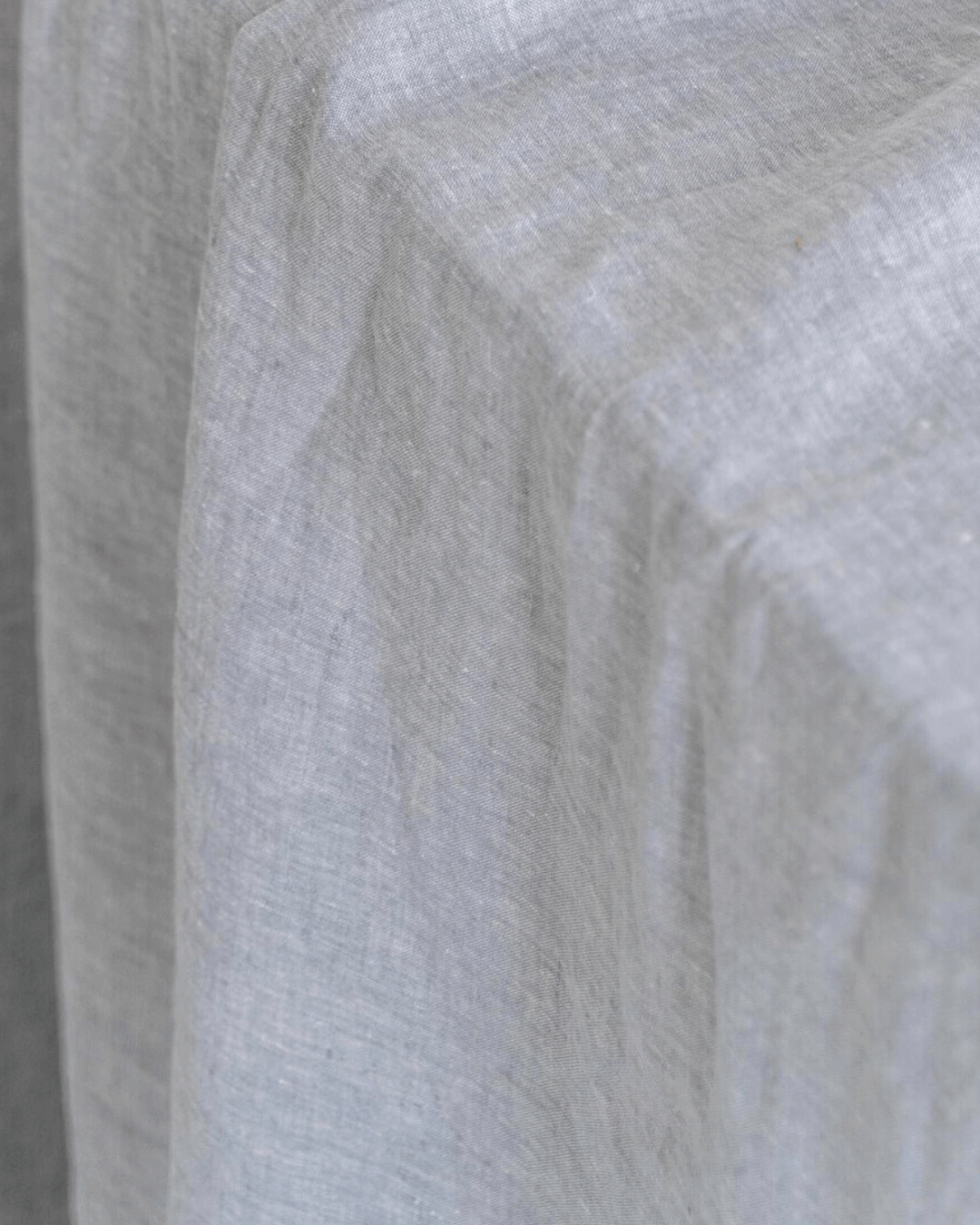 Melange gray linen fabric close-up, 190 g/m² heathered texture