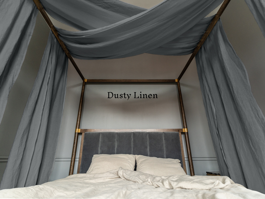 a bed with a canopy over it with a dusty linen sign above it