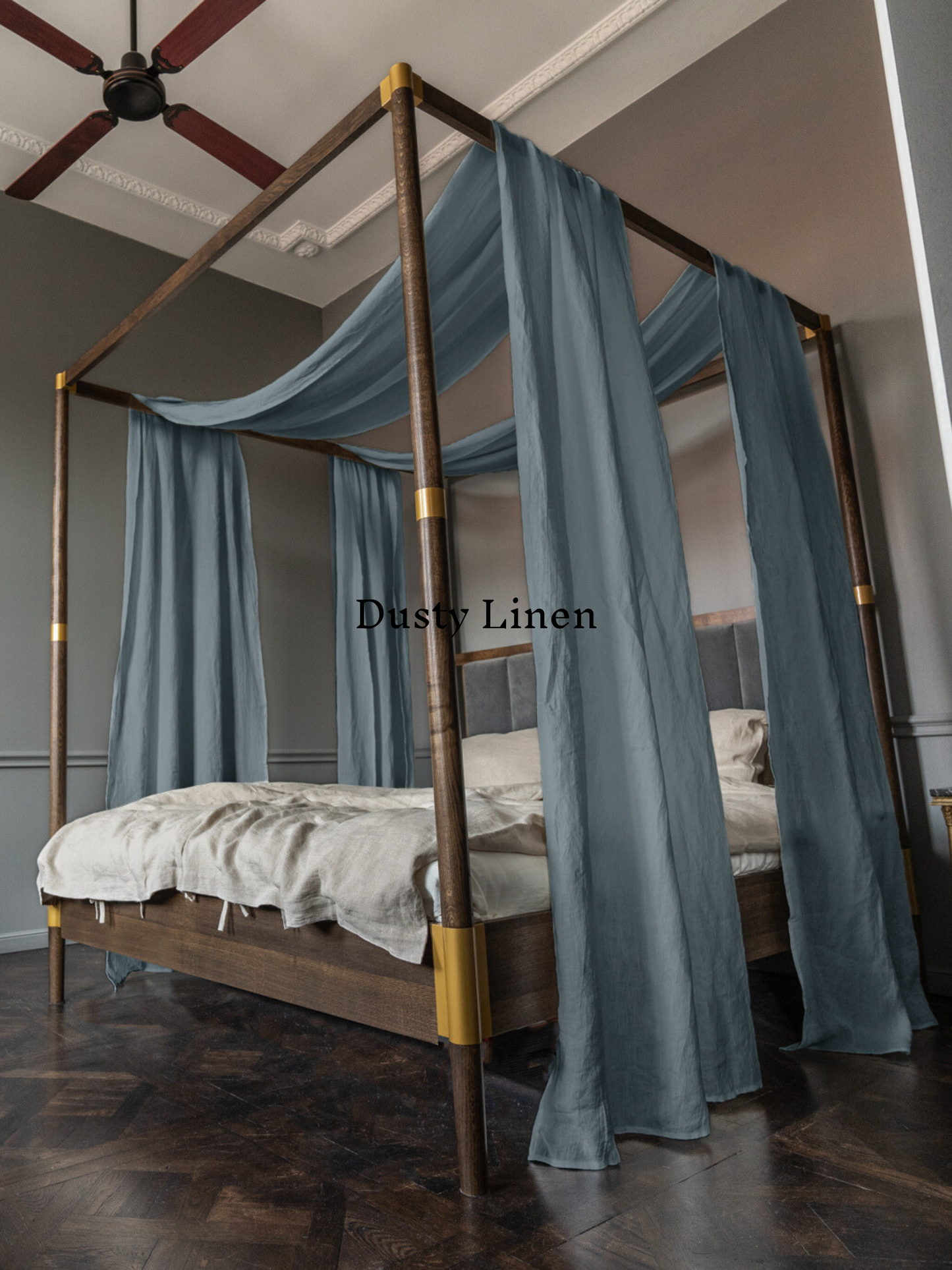 a four poster bed with blue drapes on it