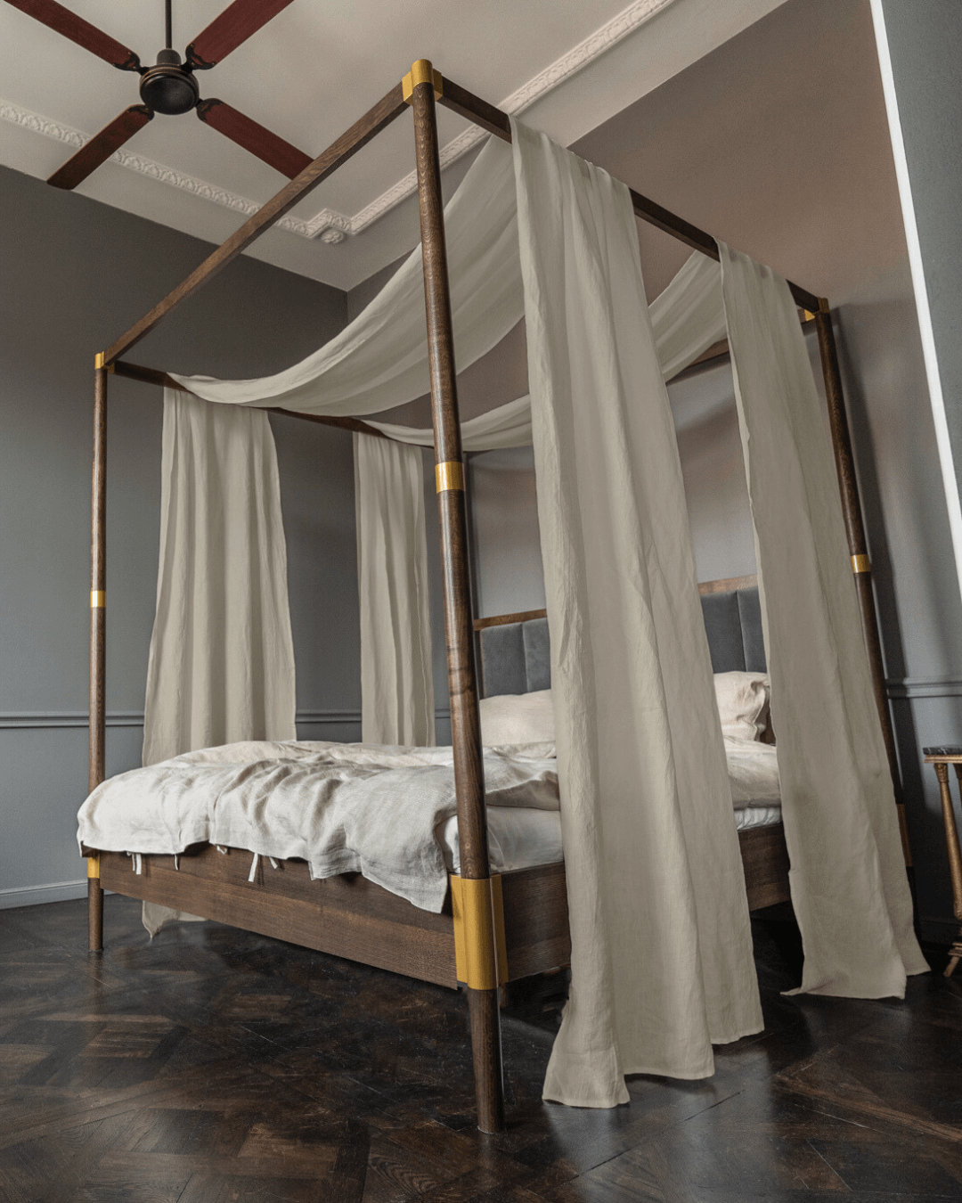 a four poster bed with a white canopy