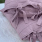 a pink pillow with a bow on it