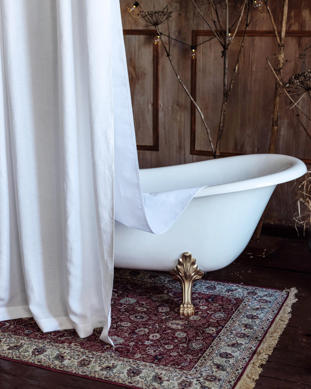 a white bath tub sitting on top of a rug