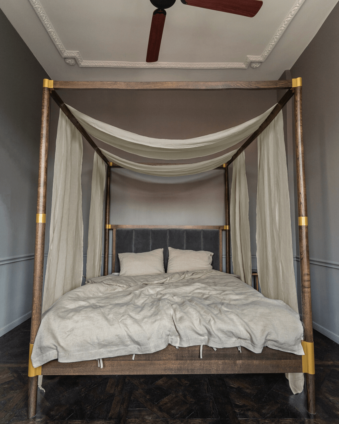 a bed with a white canopy and white sheets