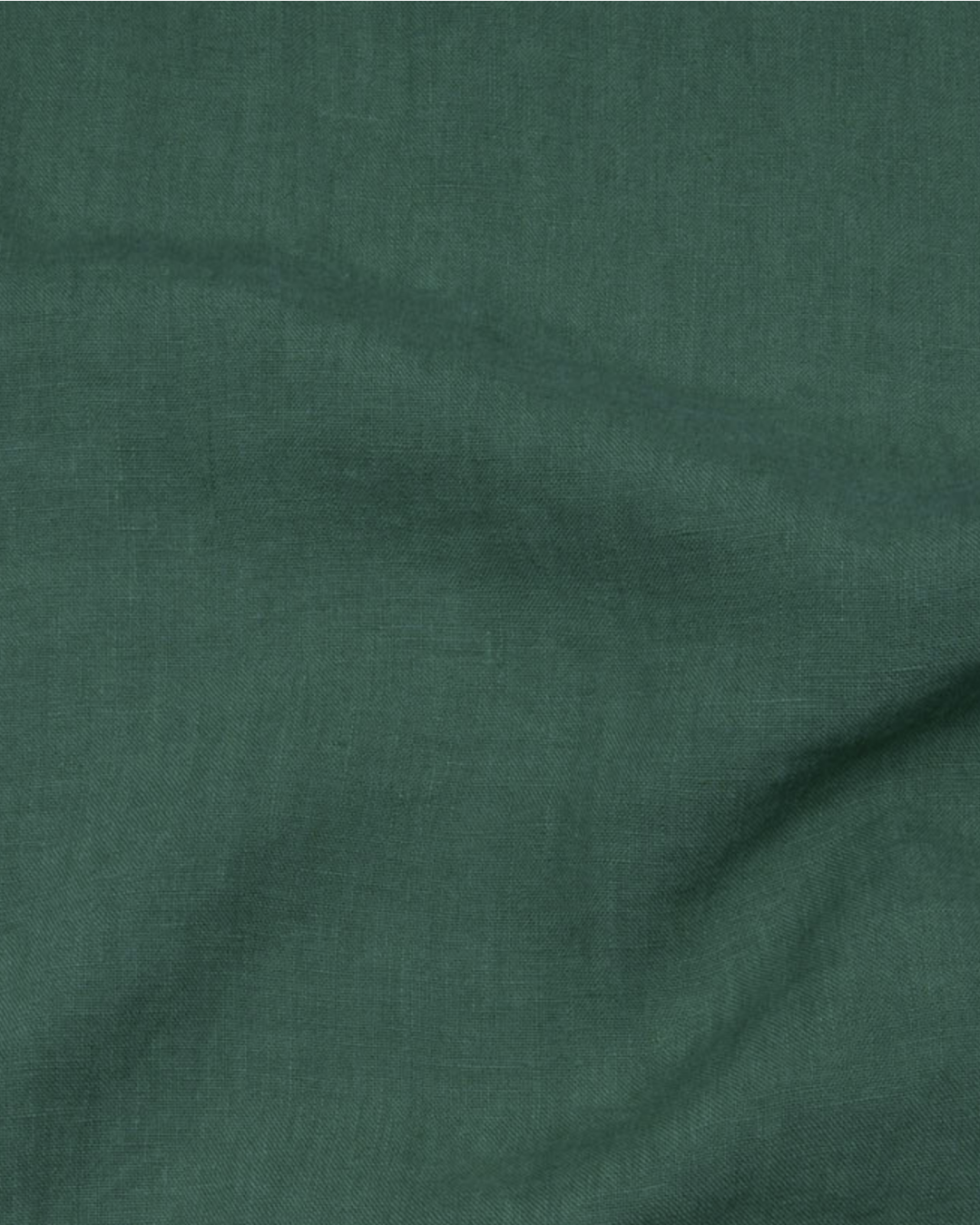 a green cloth with a white dot on it