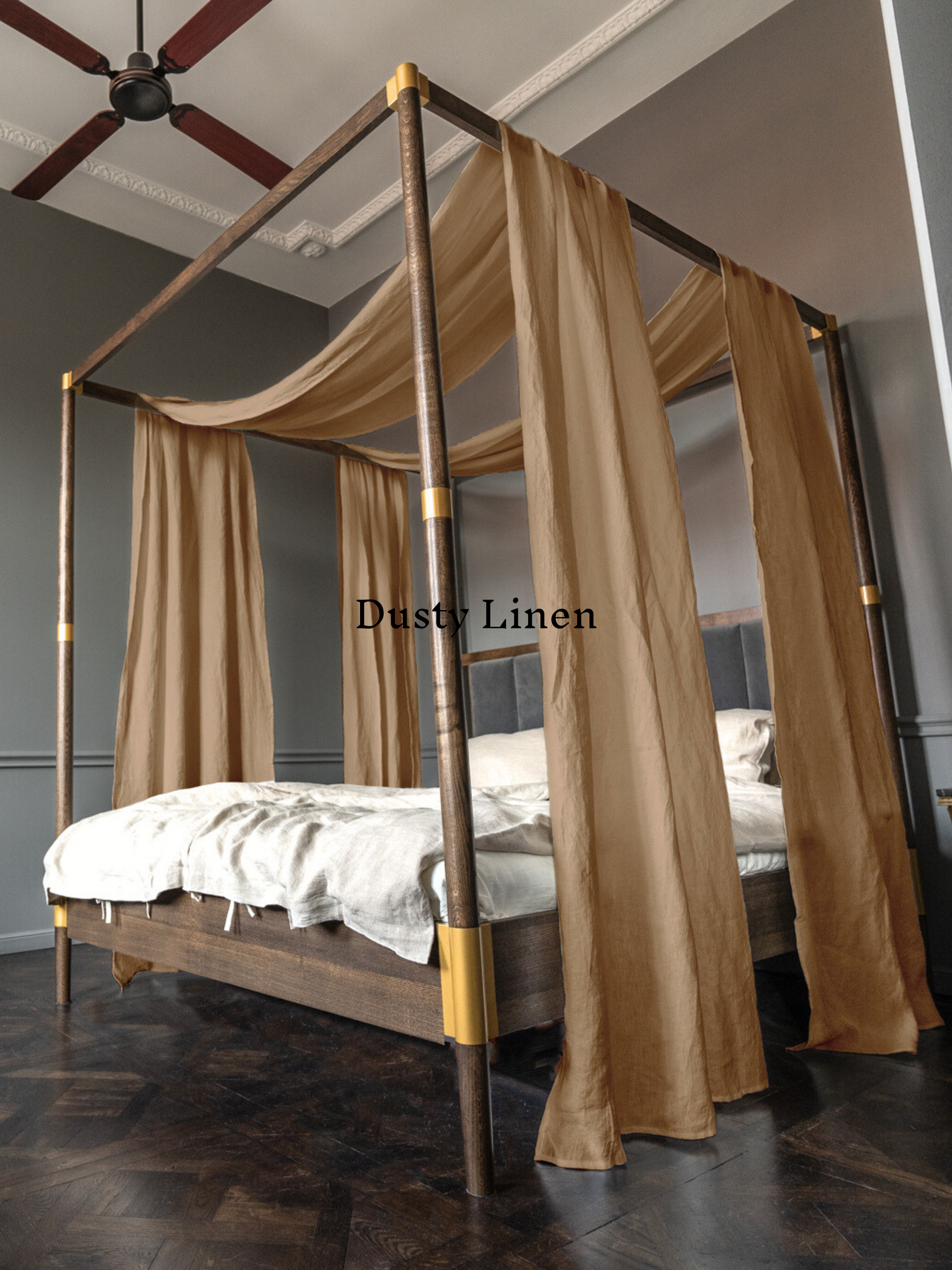 a four poster bed with a canopy and curtains