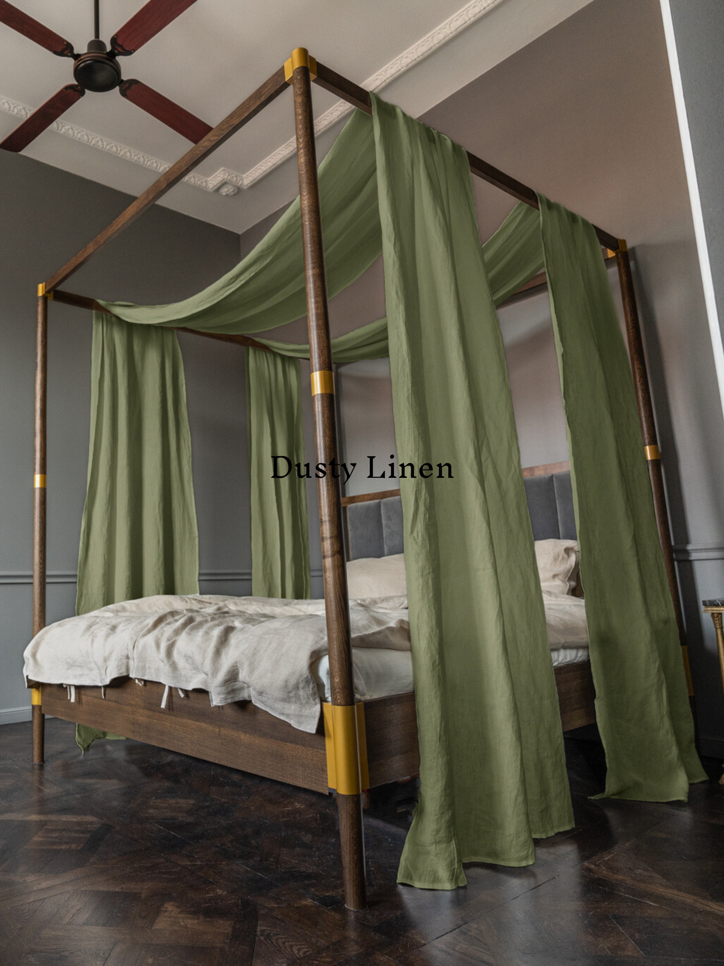 a canopy bed with a green drape over it