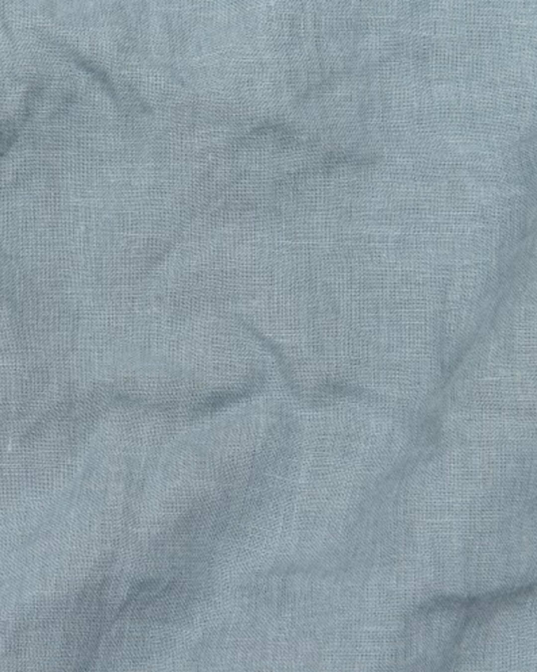 a close up of a piece of cloth with a button on it