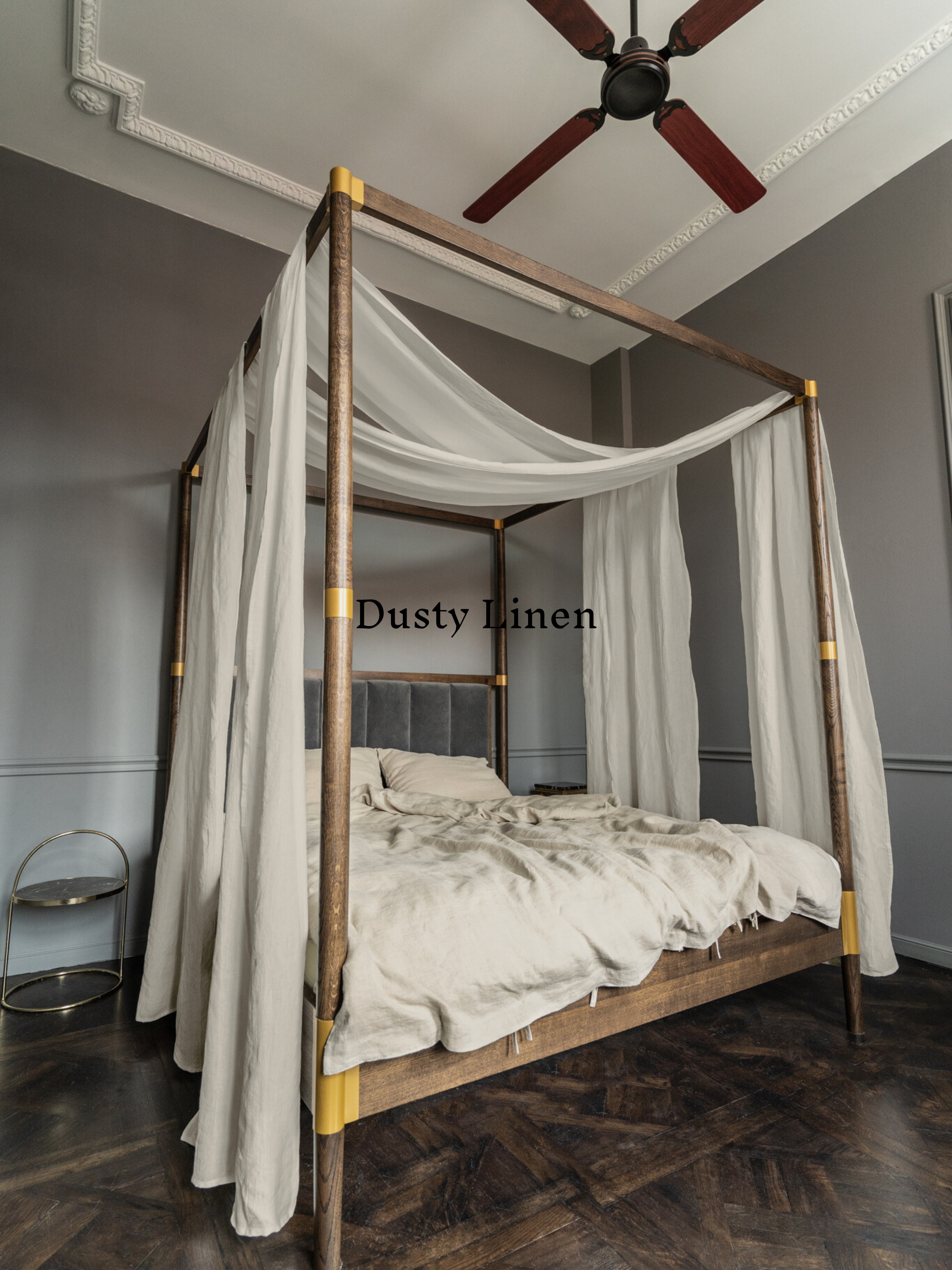 a four poster bed with a white canopy