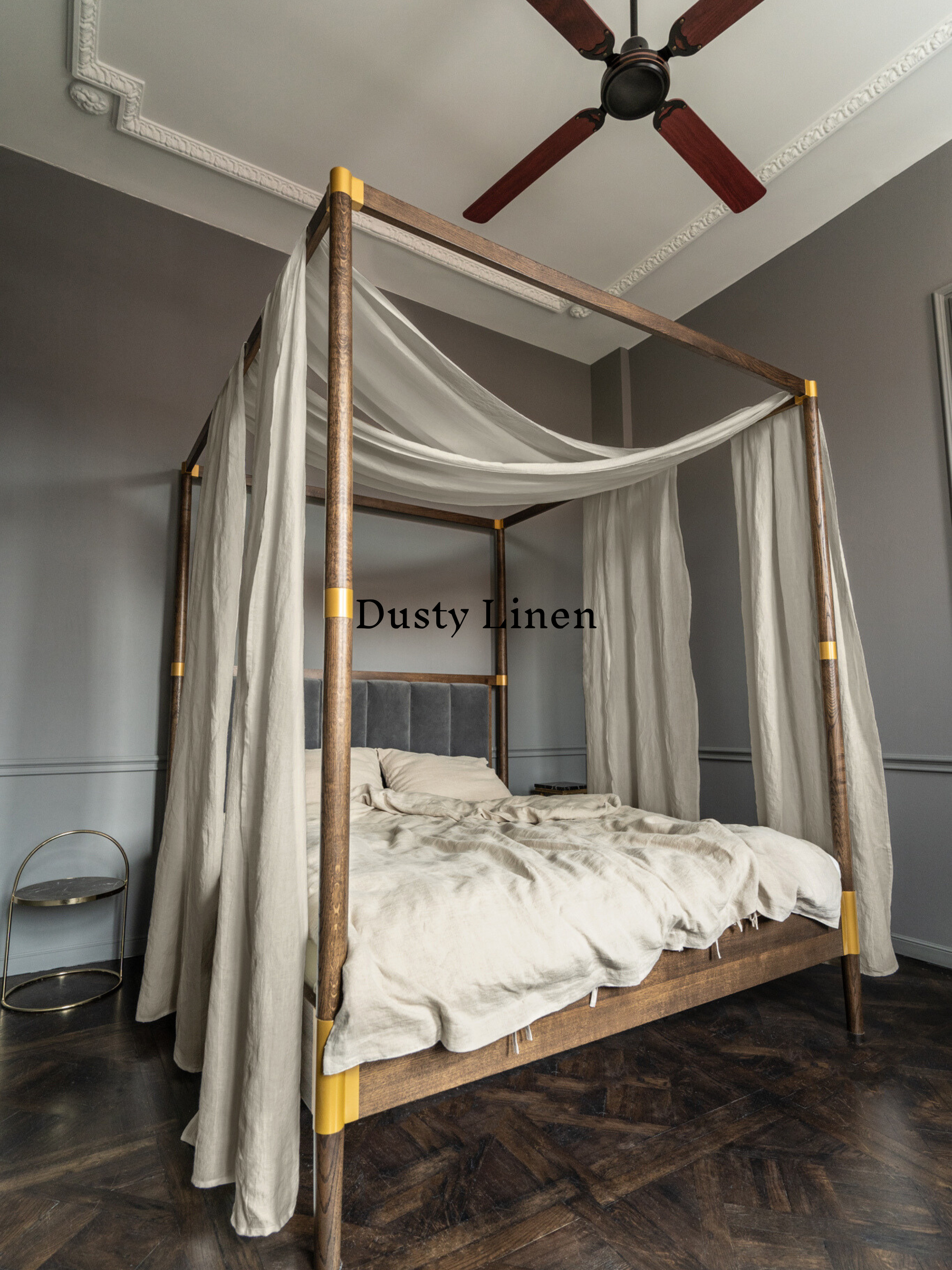 a four poster bed with a white canopy