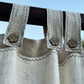 a close up of a curtain with a flower on it