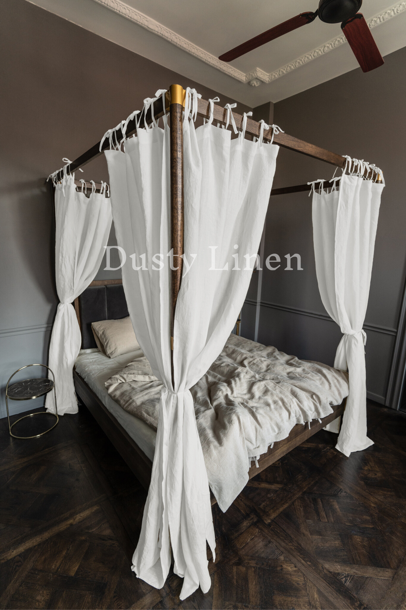 A bedroom with White color canopy bed drapes with ties in boho style. Made by DustyLinen