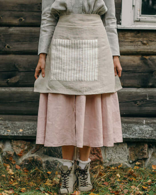 Linen half apron in various colors laid flat, color range