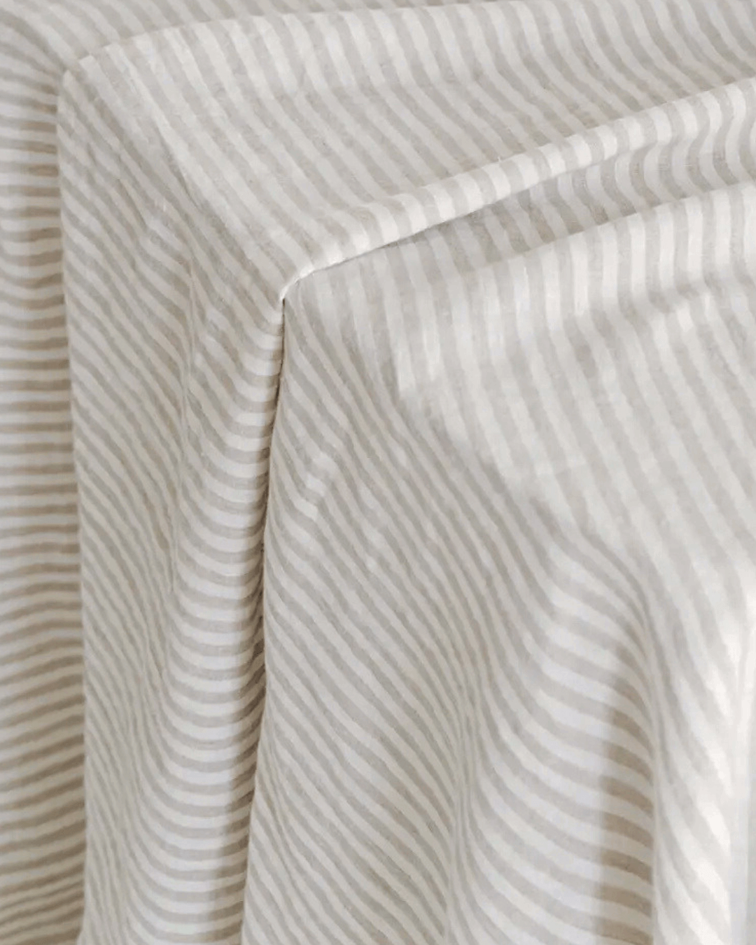 Close-up of striped natural linen fabric, 190 gsm texture detail