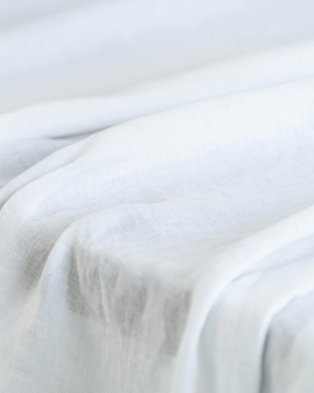Close-up of white linen fabric, softened 175 g/m² texture