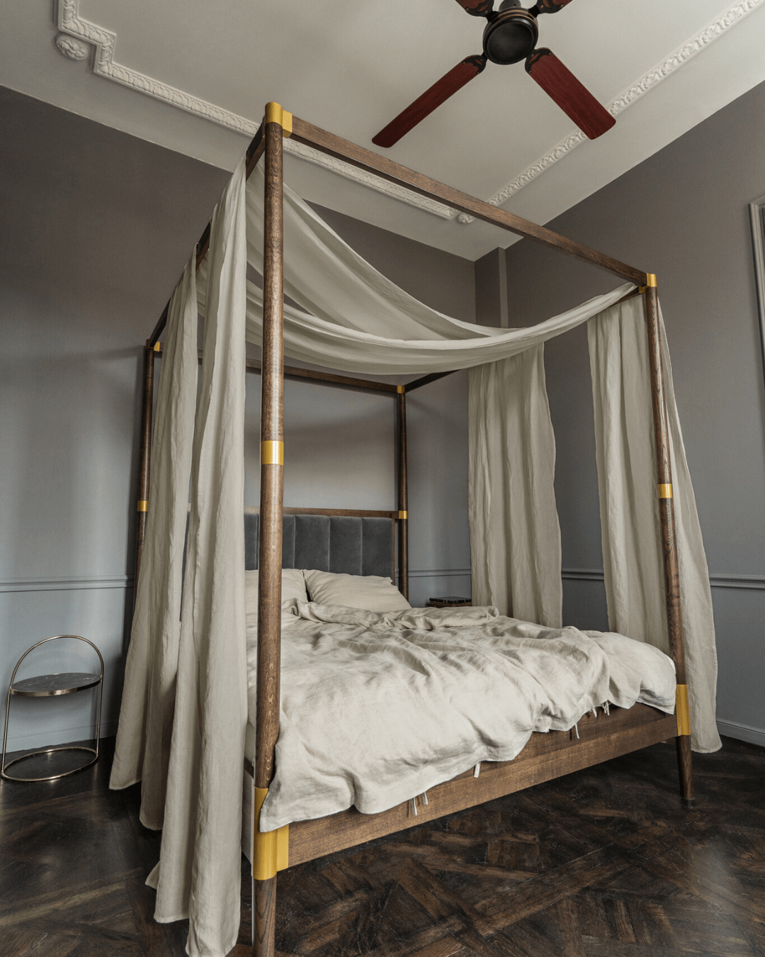a four poster bed with a white canopy