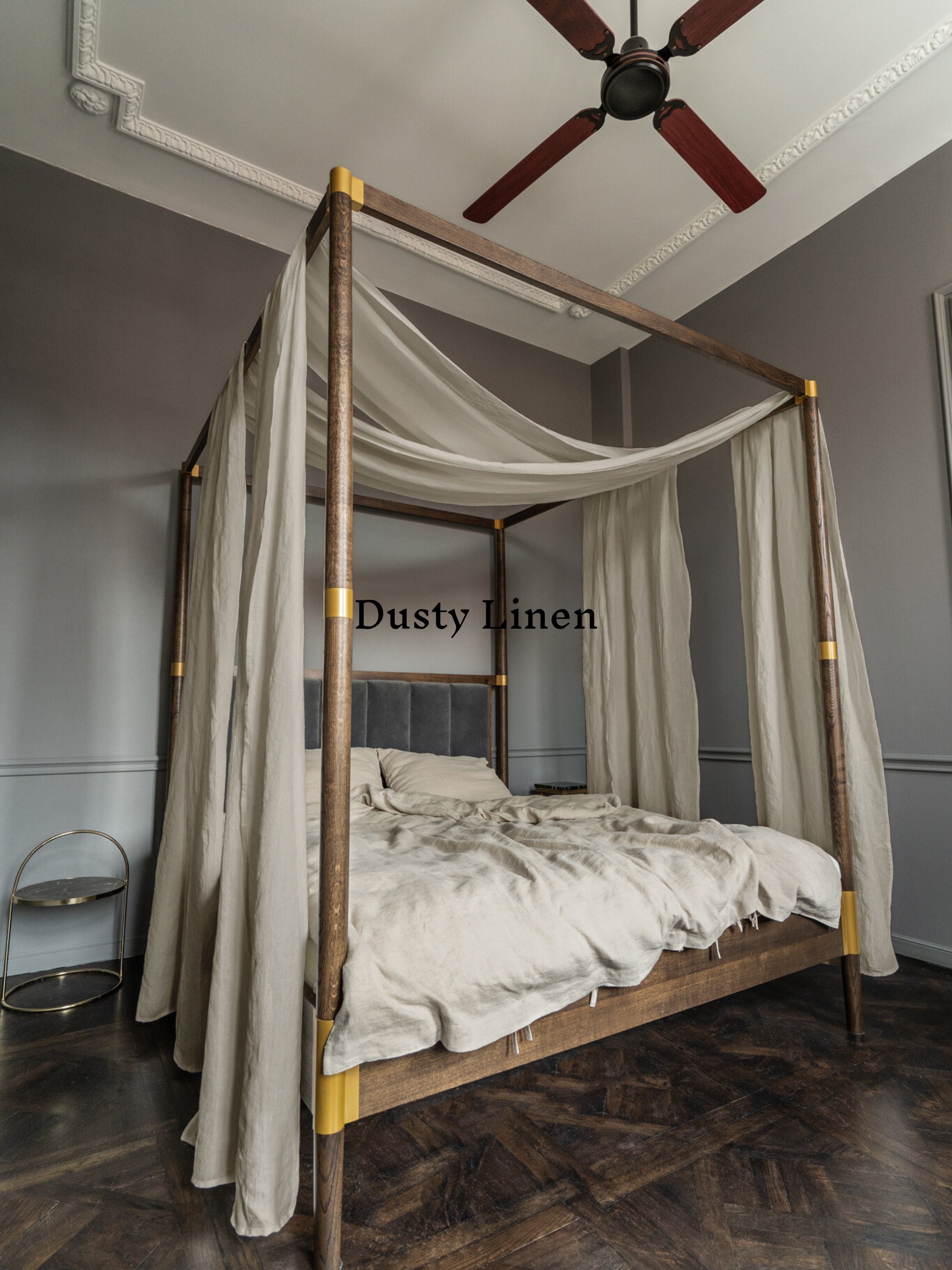 a four poster bed with a white canopy