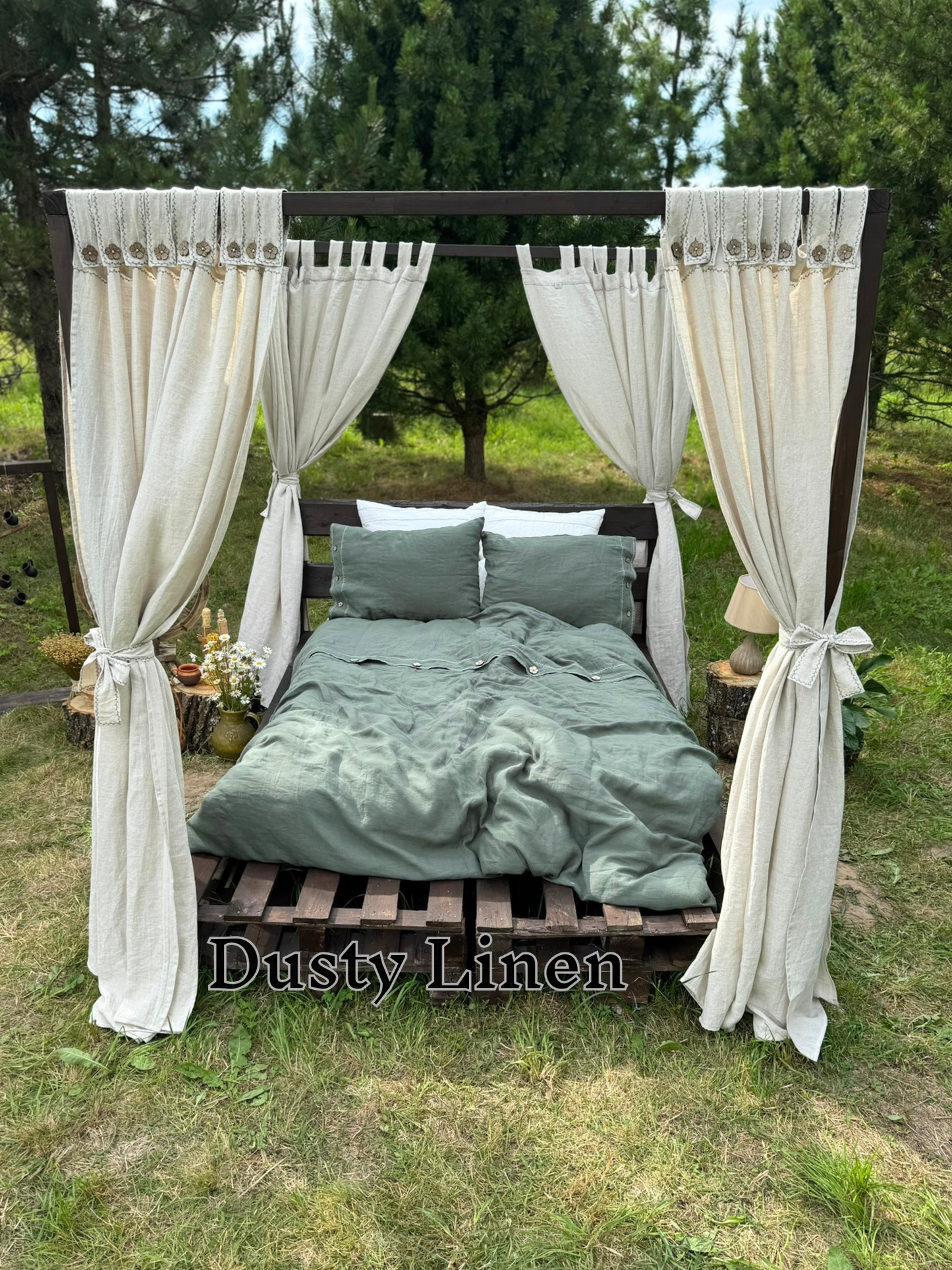 a bed made out of a pallet with a canopy