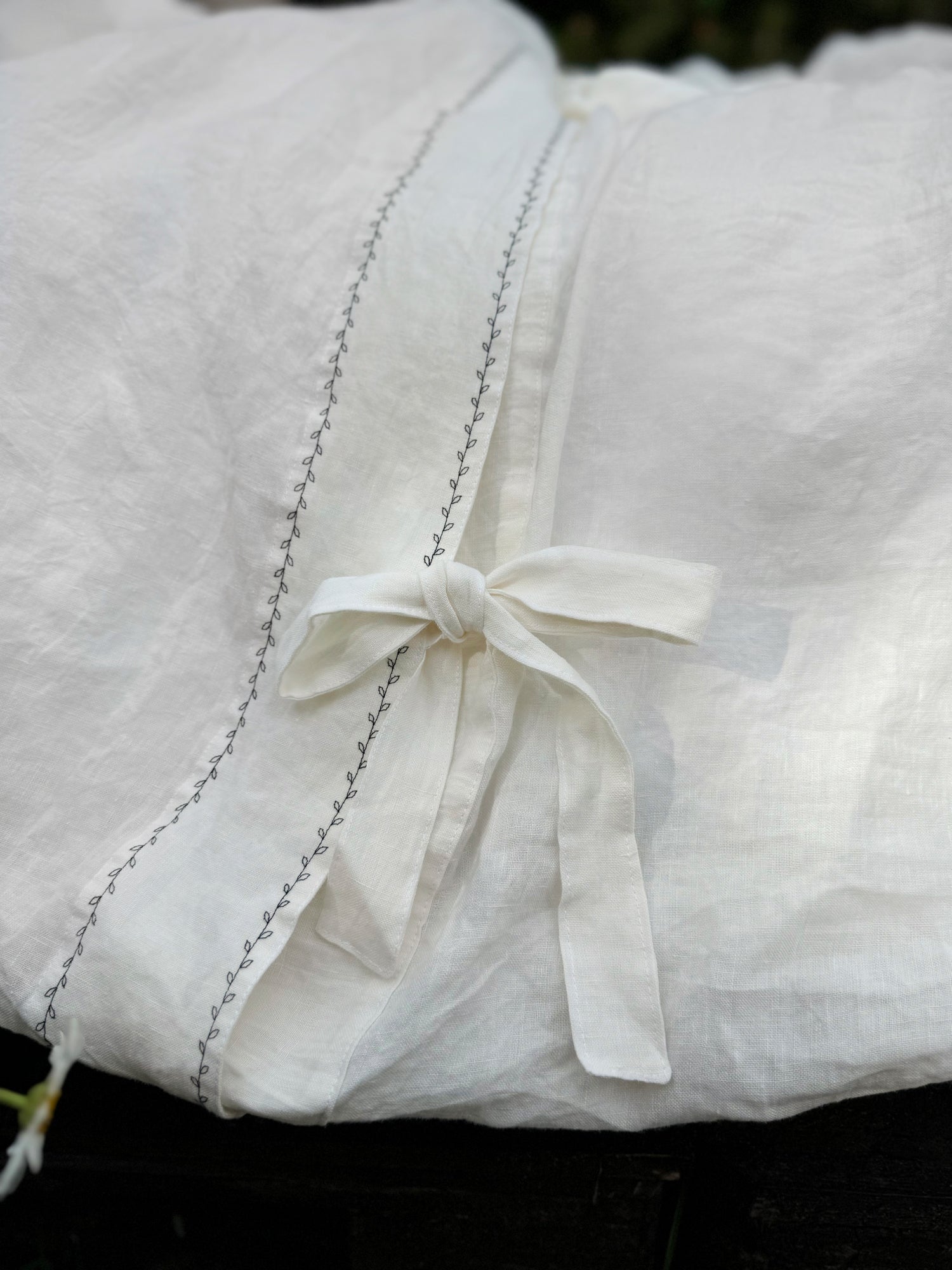 Reverse side of black embroidered linen duvet cover EU, UK, US size, top closure button