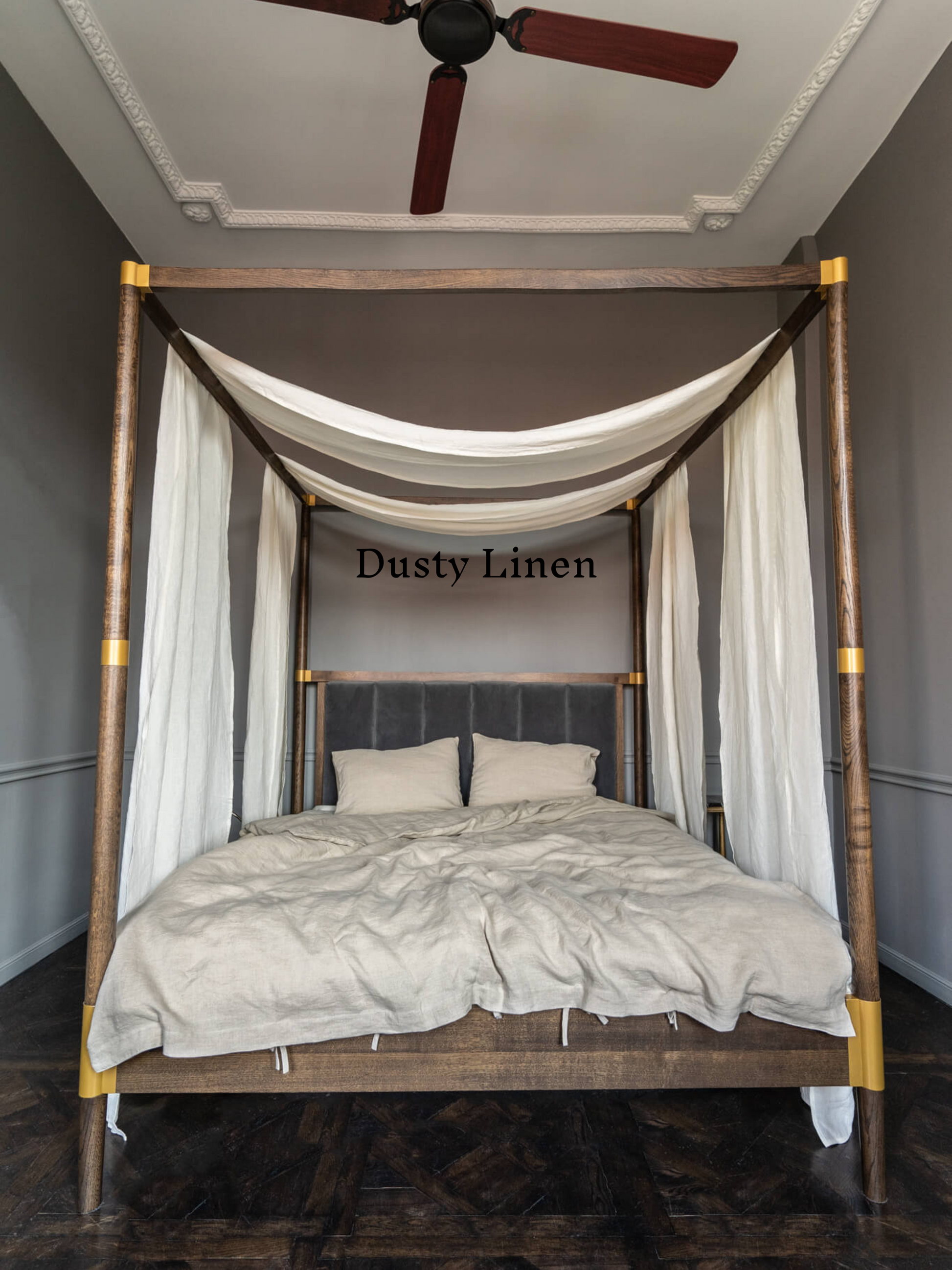 a four poster bed with a white canopy