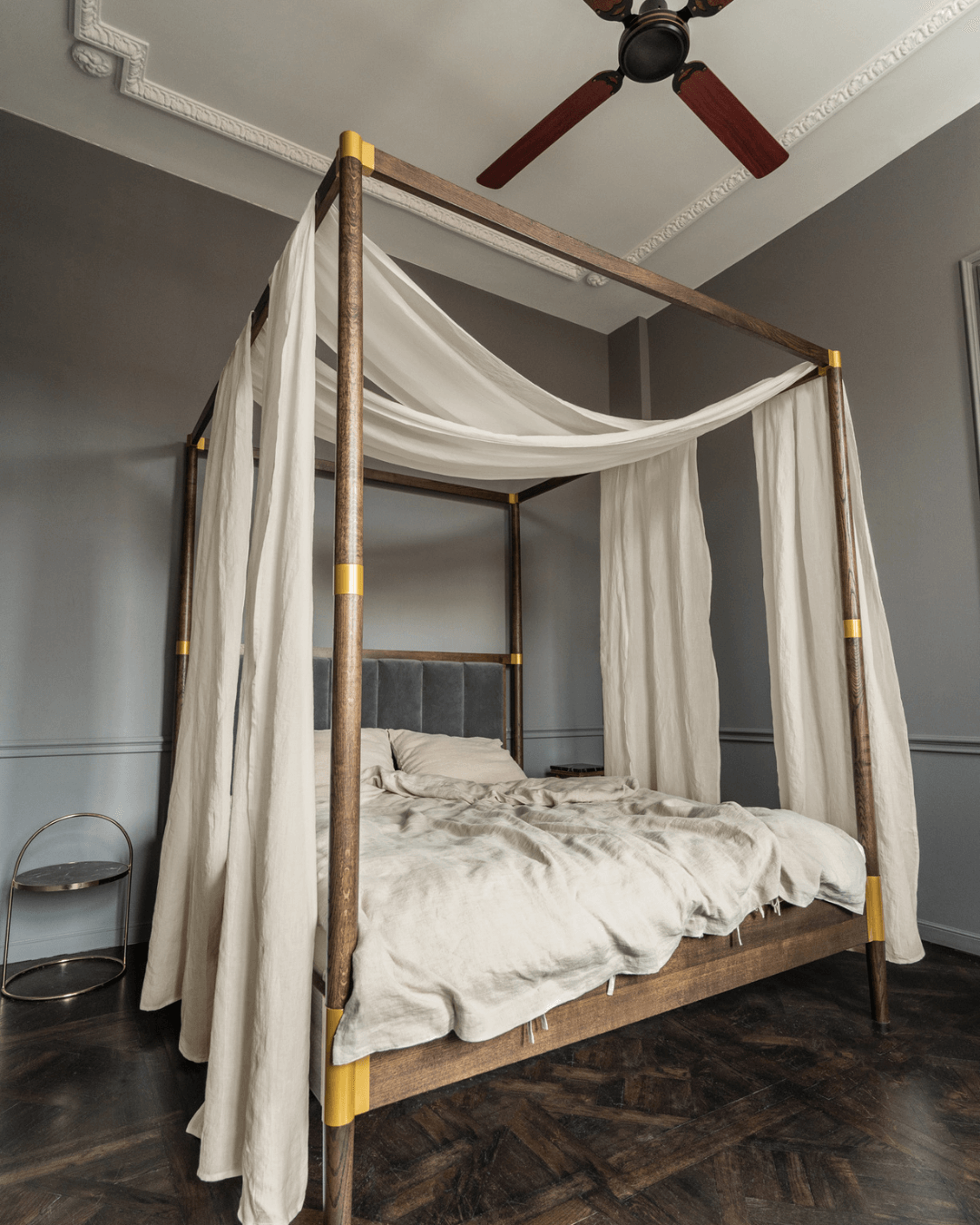 a four poster bed with a white canopy