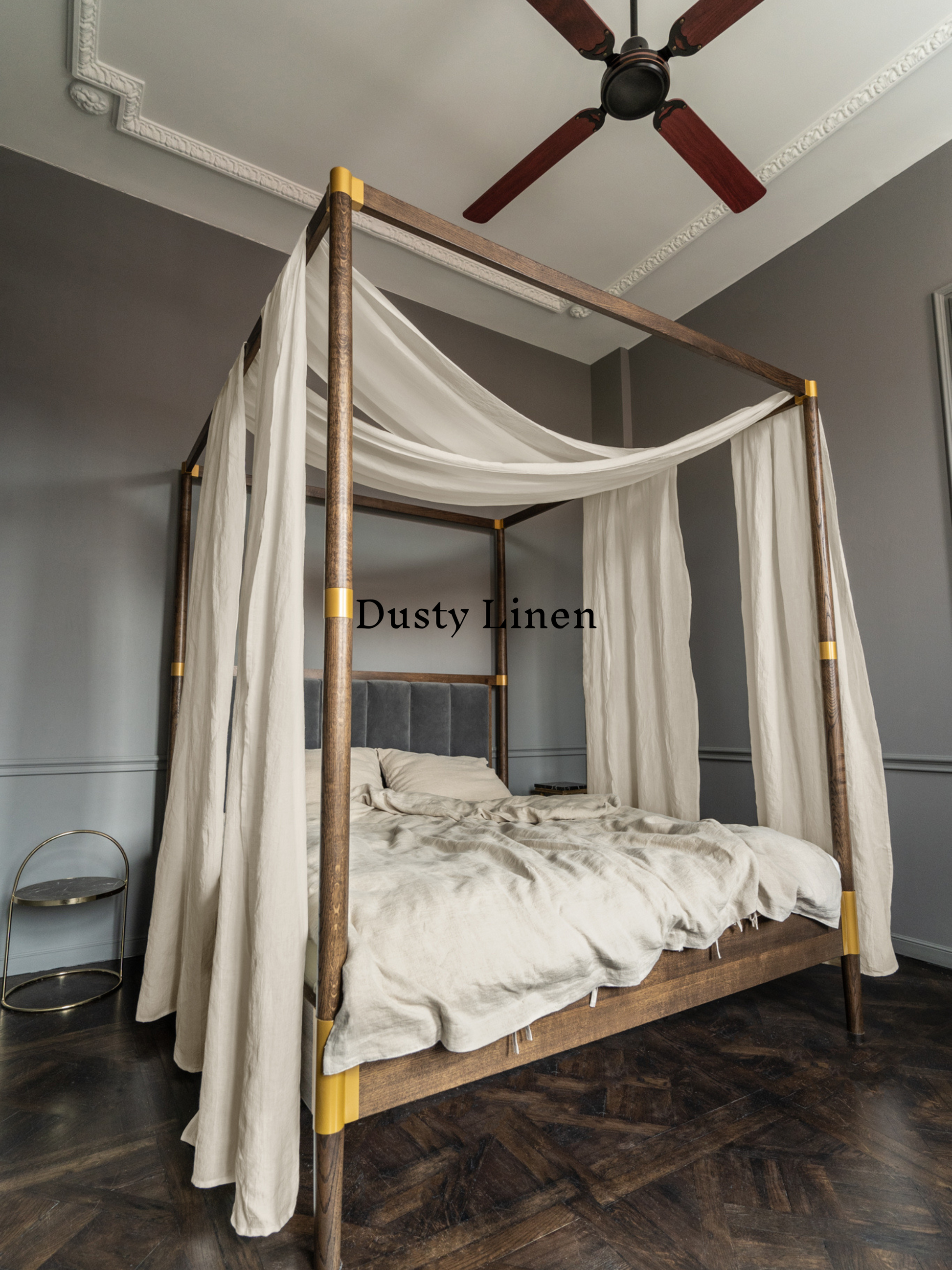 a four poster bed with a white canopy