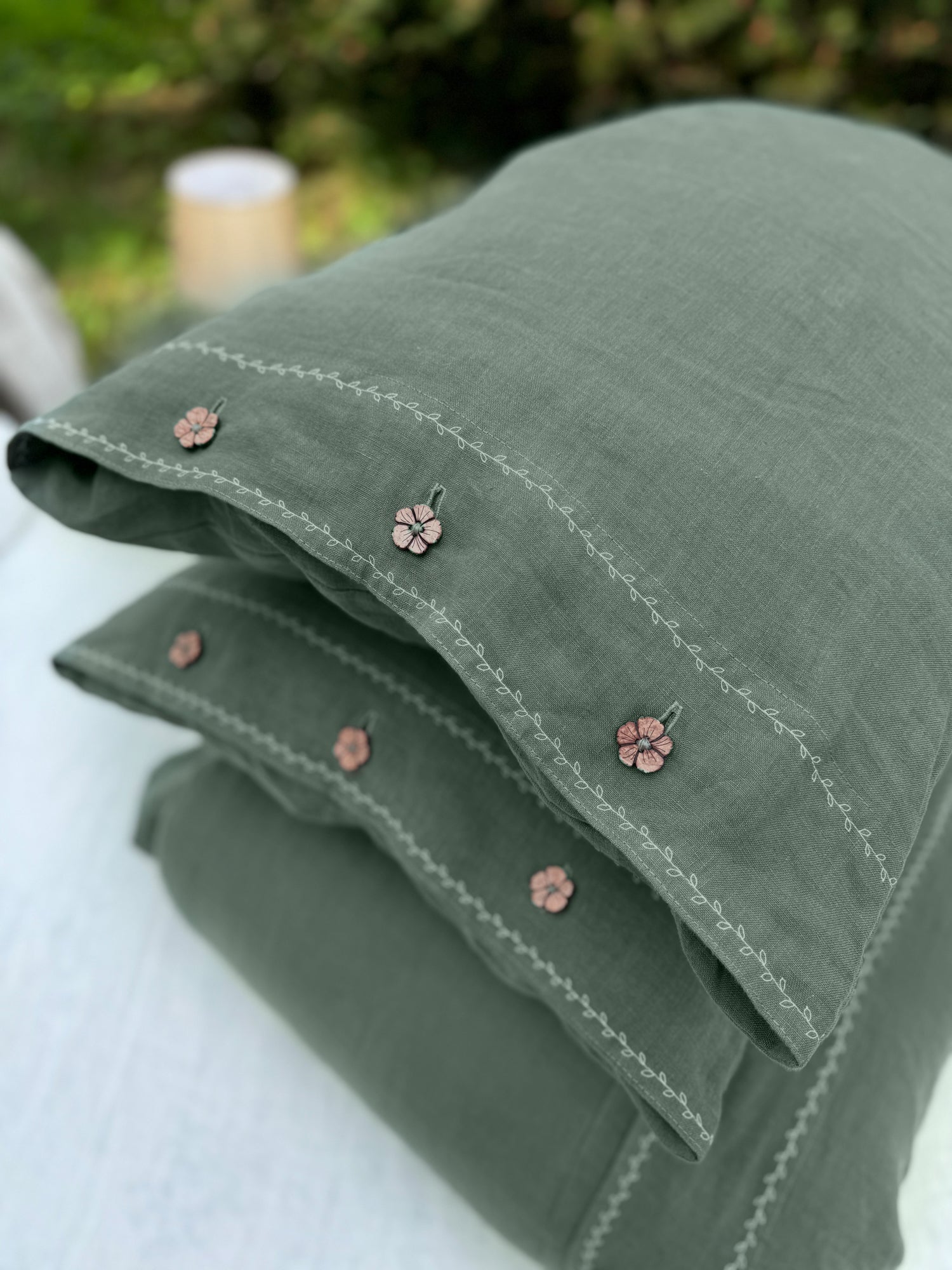 a close up of three pillows on a table