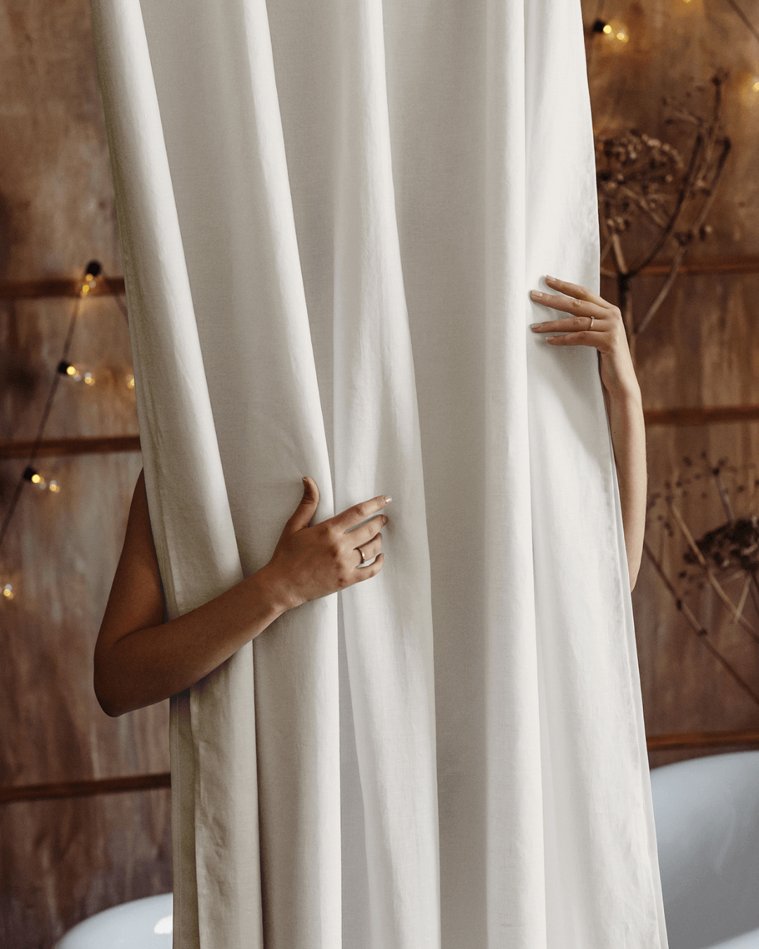 Cream waterproof linen shower curtain, side drape and weight detail
