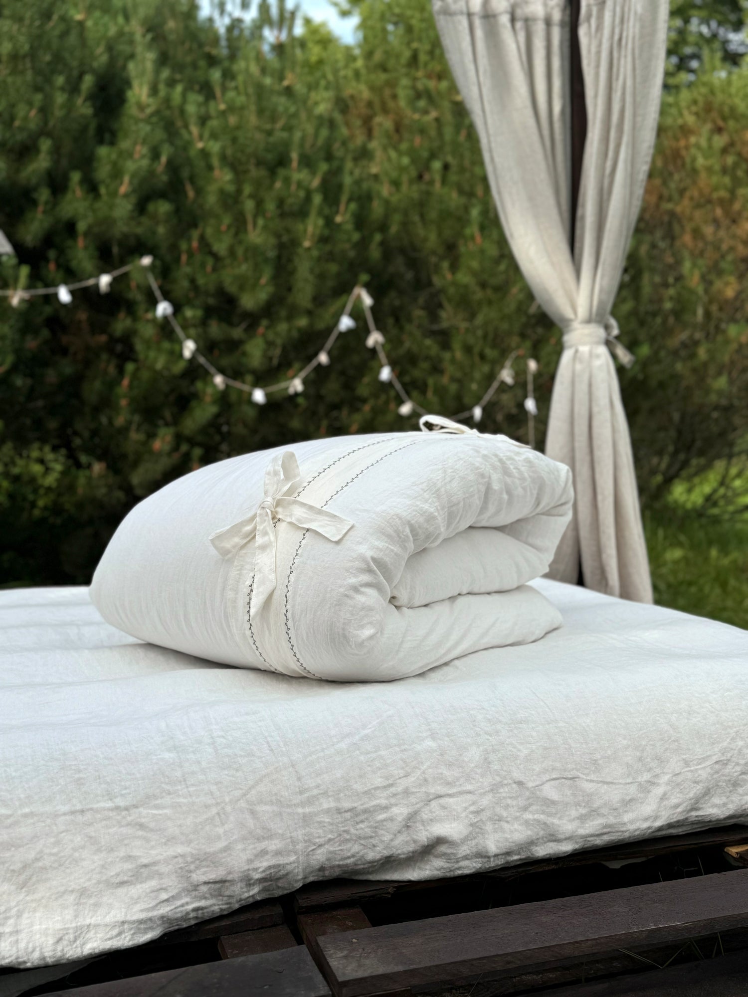 Black embroidered linen pillowcases on bed, EU, UK, US size bedding set