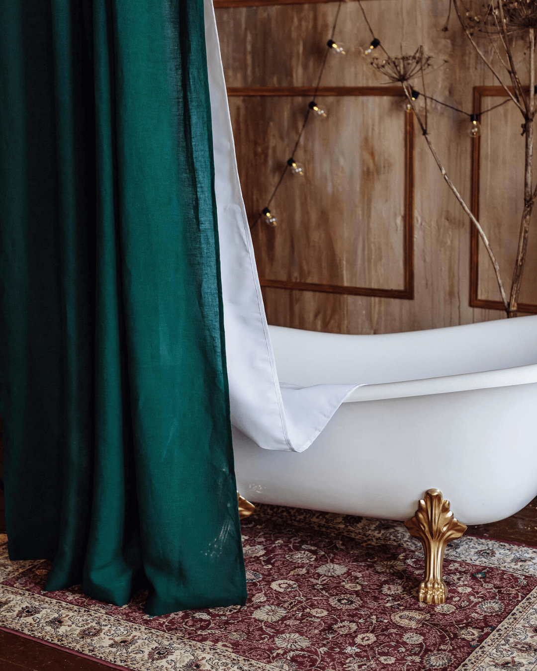 Emerald green extra long shower curtain beside freestanding tub