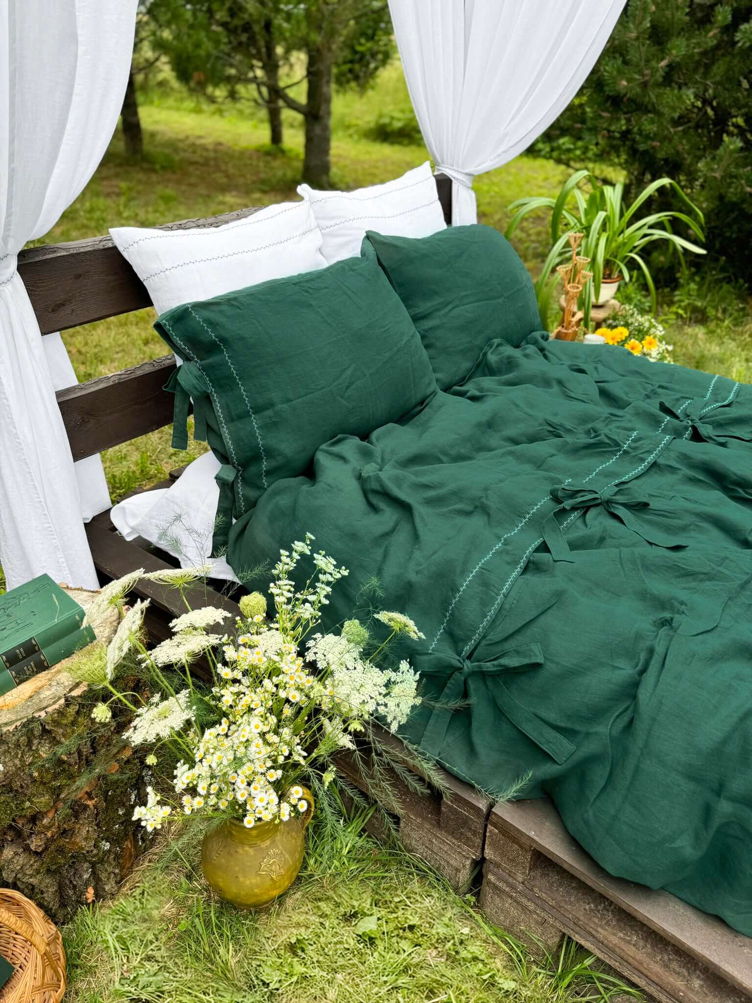 White embroidered linen duvet cover on bed, bedroom lifestyle photo