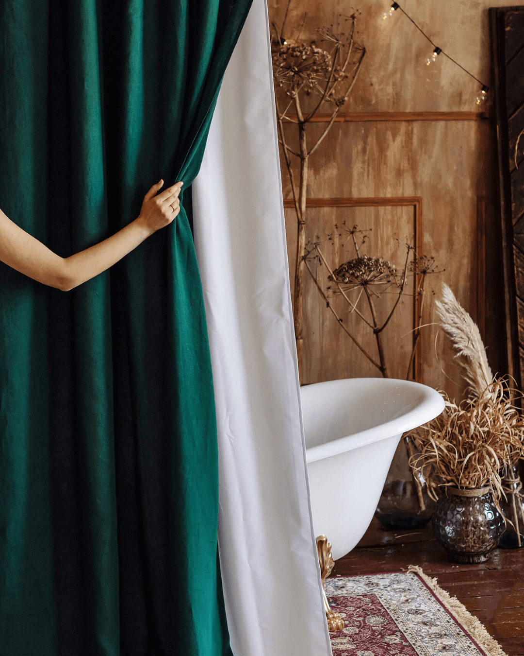 Emerald green extra long shower curtain in styled bathroom with bathtub