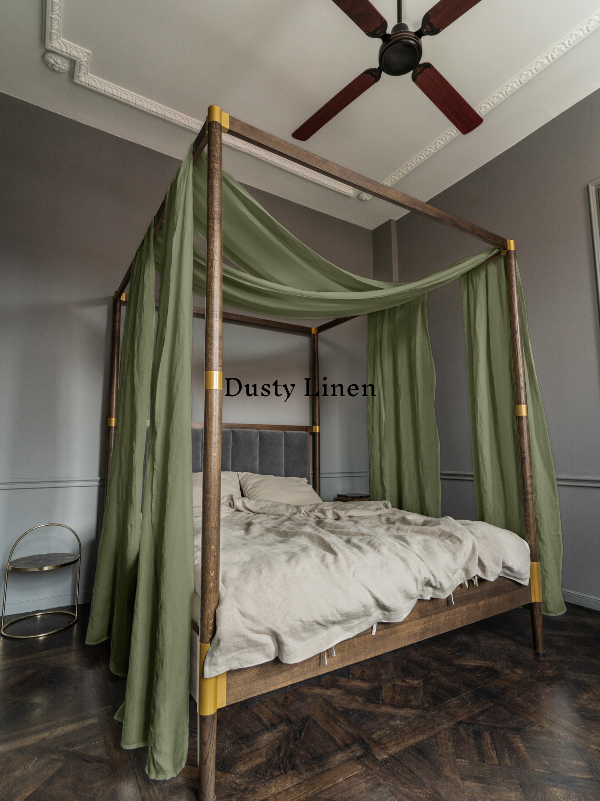 a four poster bed with a green canopy