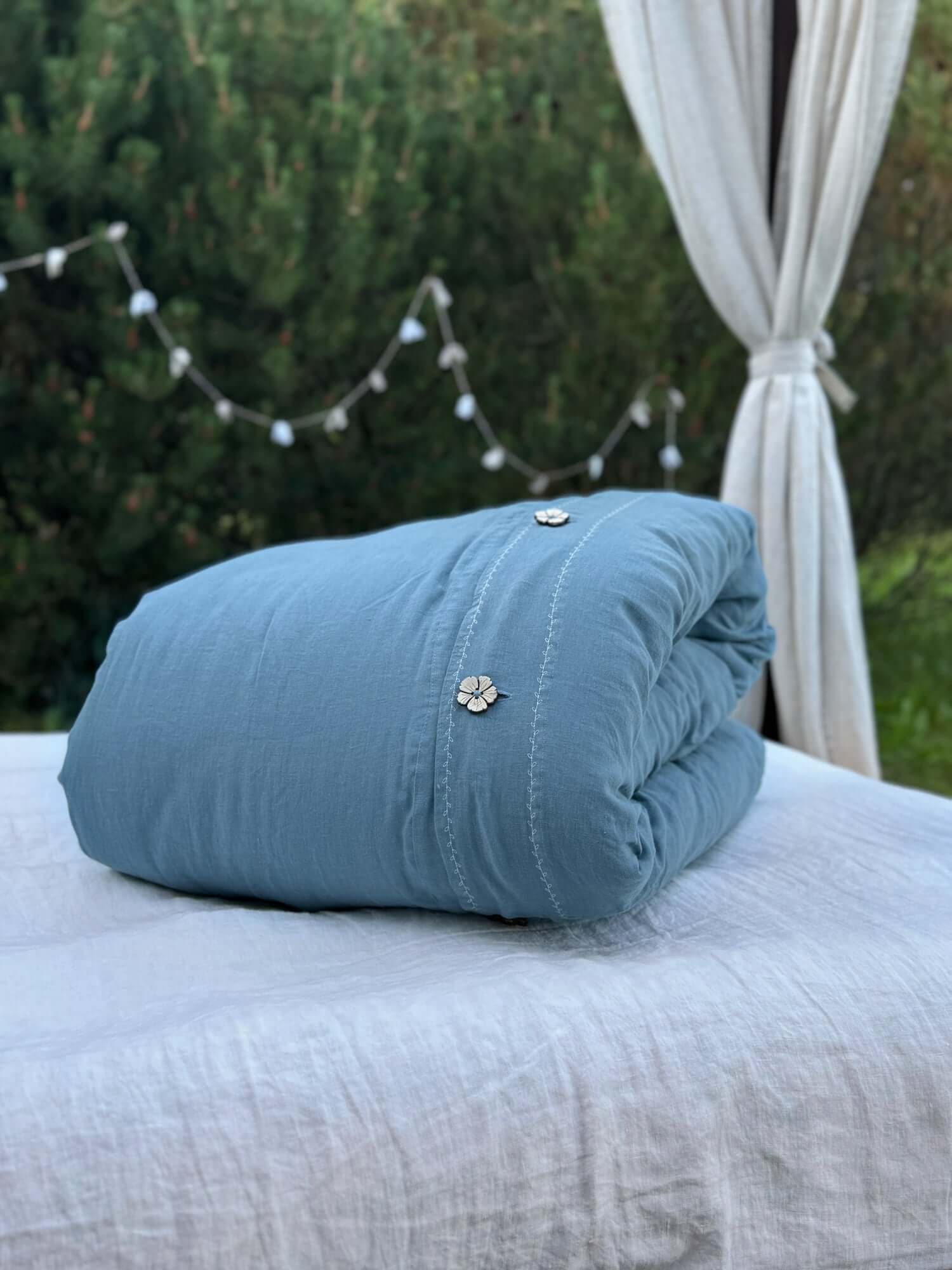 White embroidered linen duvet cover with gray blue linen pillowcase