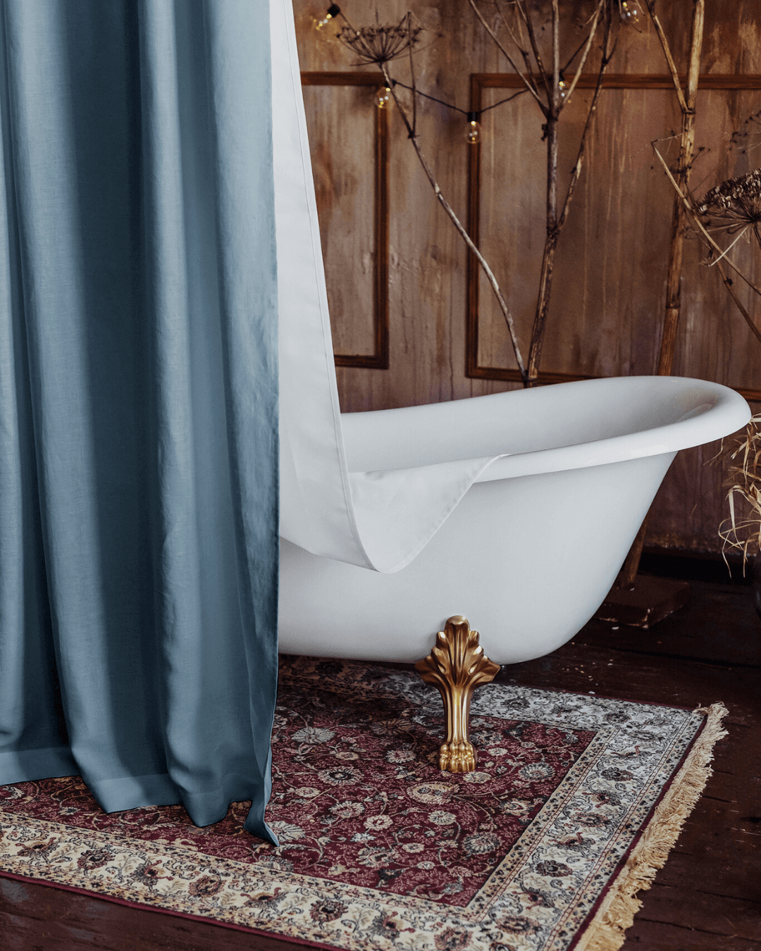 Gray blue bathroom shower curtain in French-style bathroom with freestanding tub