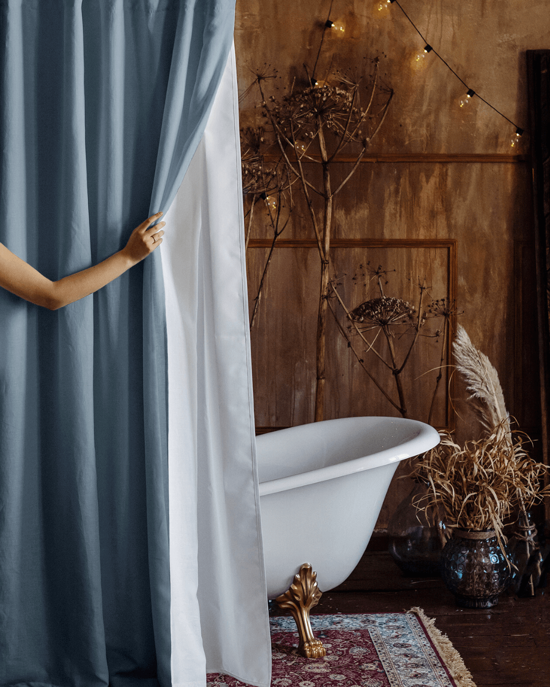 Gray blue bathroom shower curtain in rustic bathroom, rod hung view