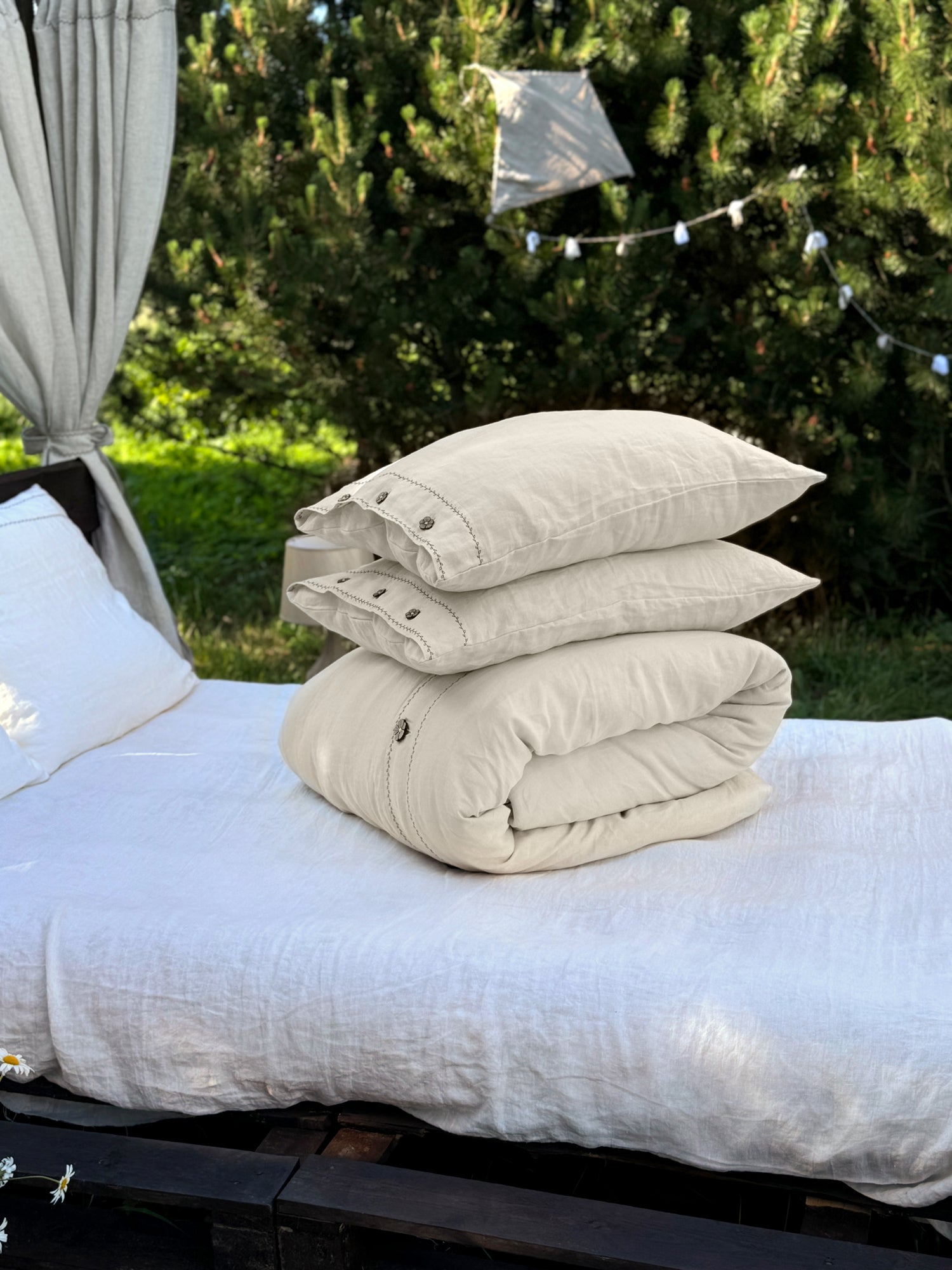 Black embroidered linen bedding set, corner and stitching detail