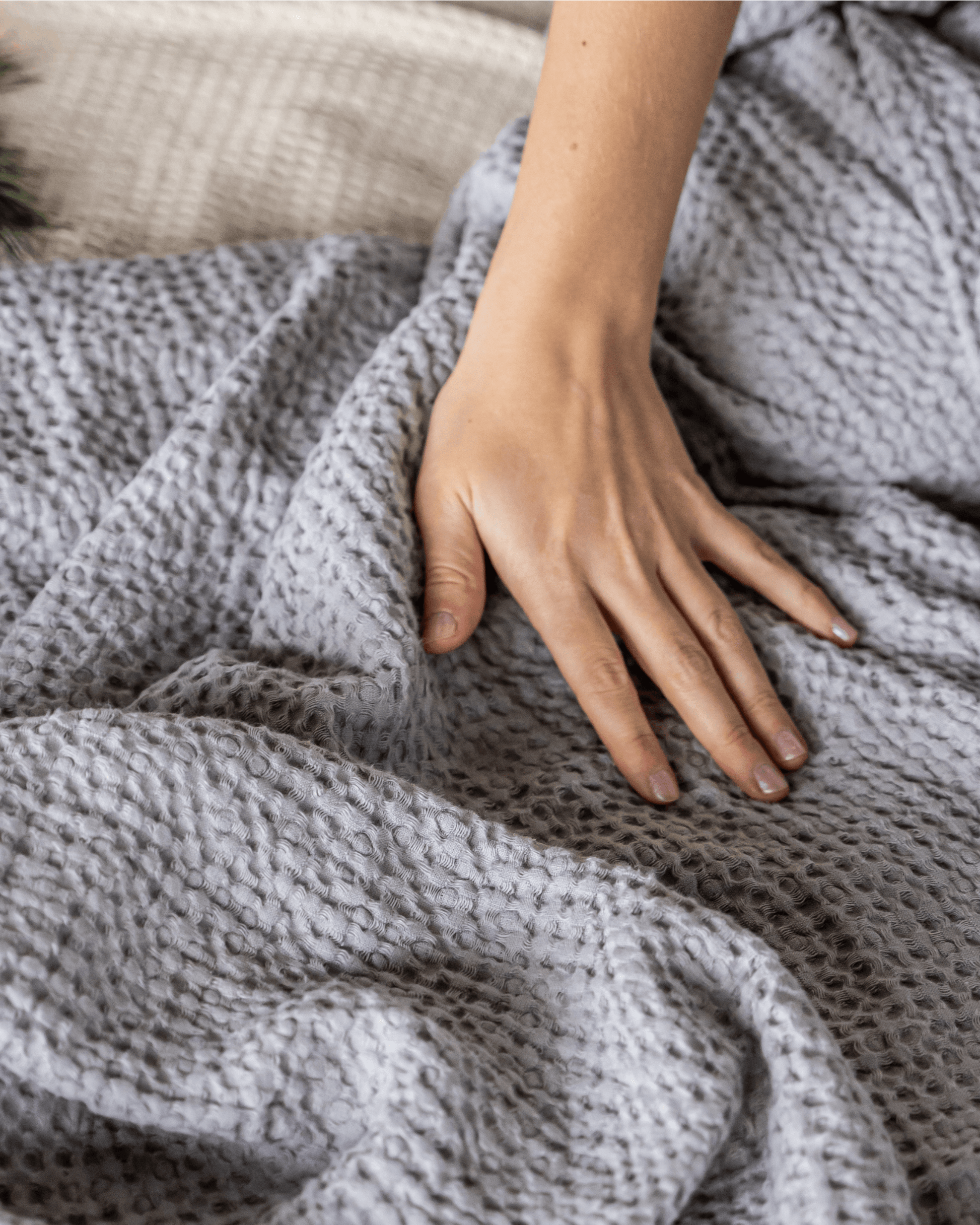 Large waffle blanket light grey - texture close-up on bed, linen-cotton blend