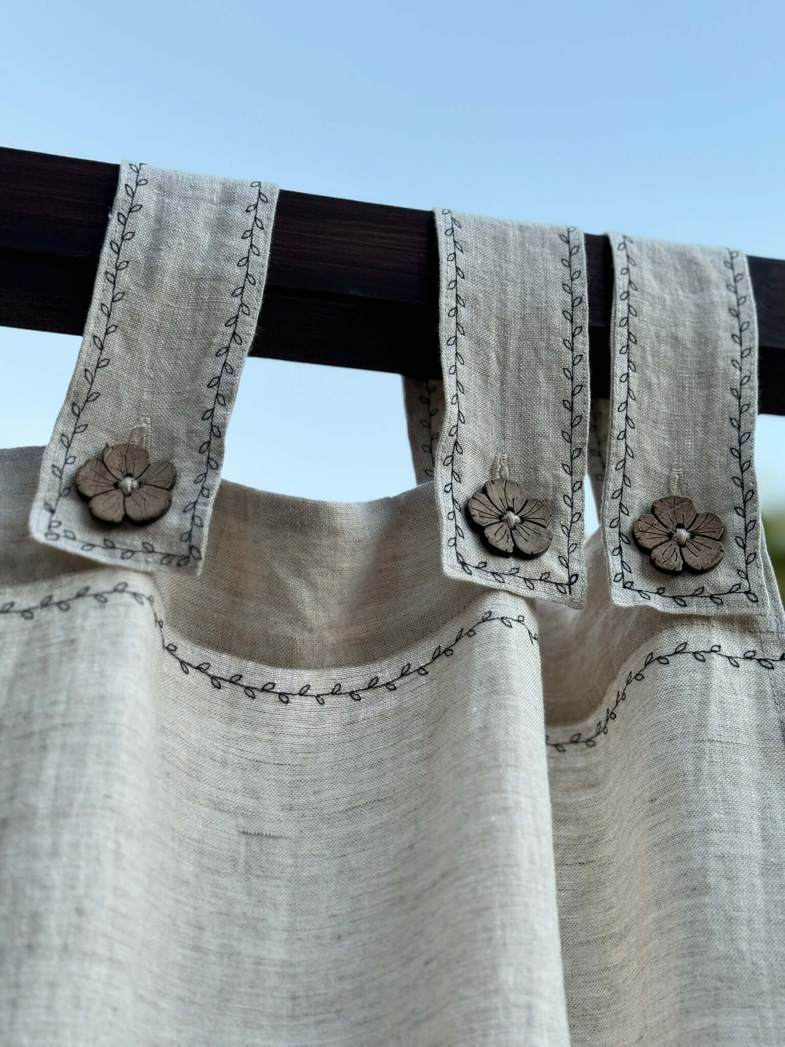 Close-up of linen canopy curtain fabric with decorative detail