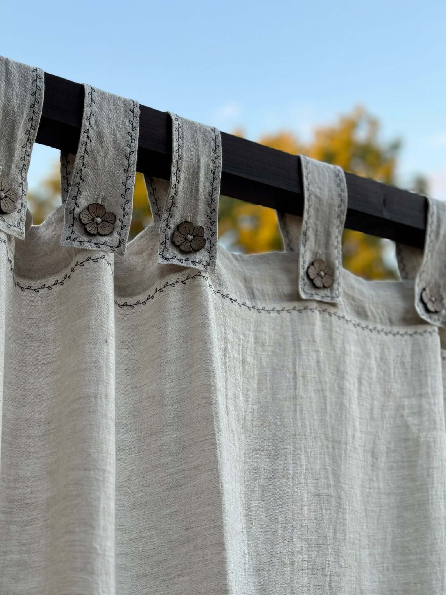 Button tab top detail on made-to-order linen canopy bed curtain
