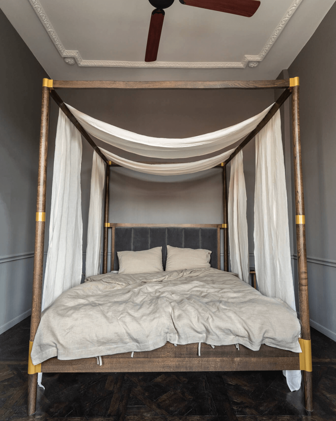 Linen canopy shawl on four-poster bed, side angle view