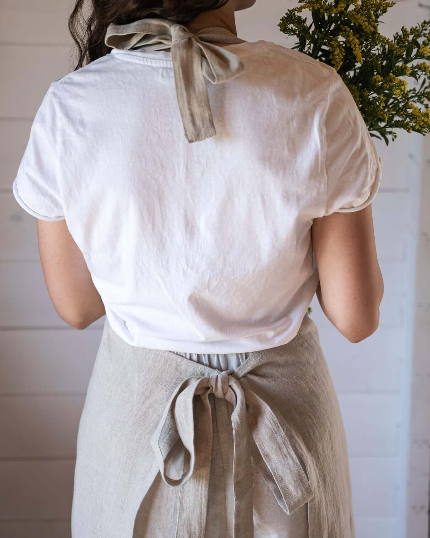 Full linen apron in white, front view showing bib and skirt