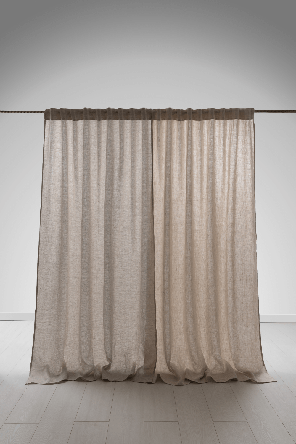 Linen curtain fullness example showing how fabric gathers on a curtain rod