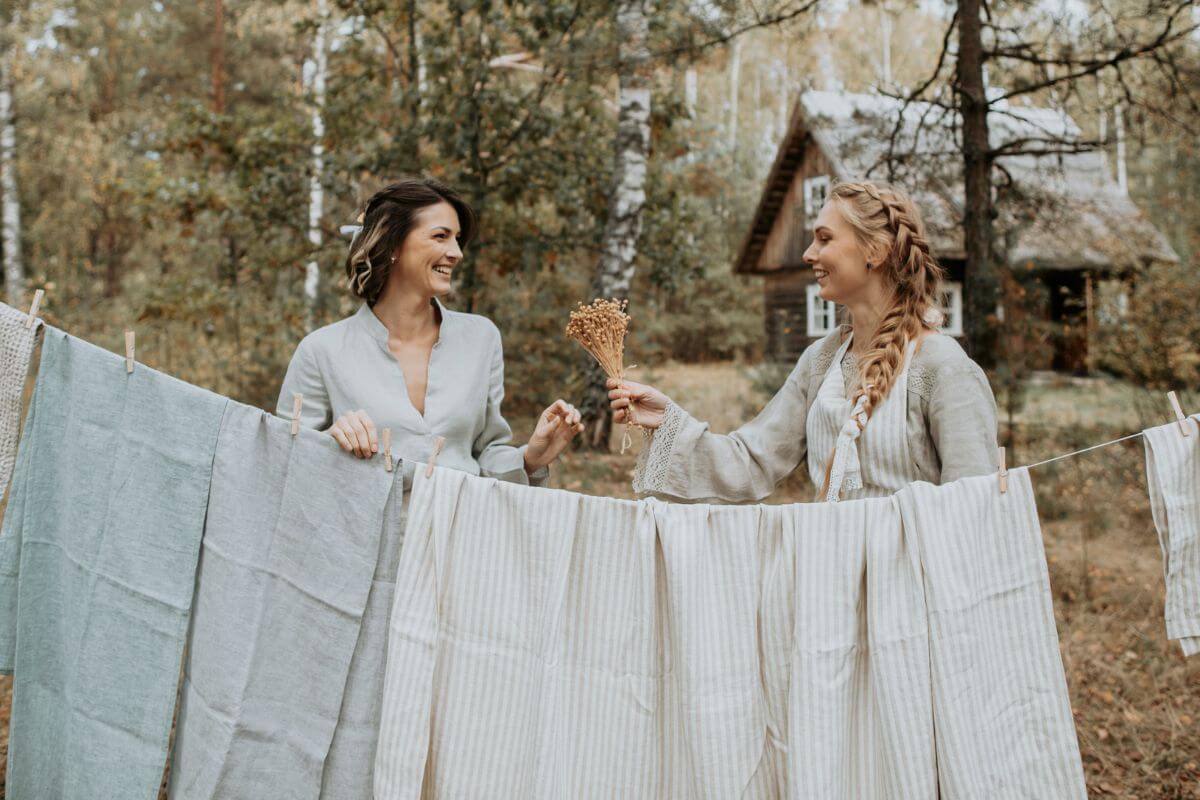 Linen curtain panels hanging on rod, neutral interior