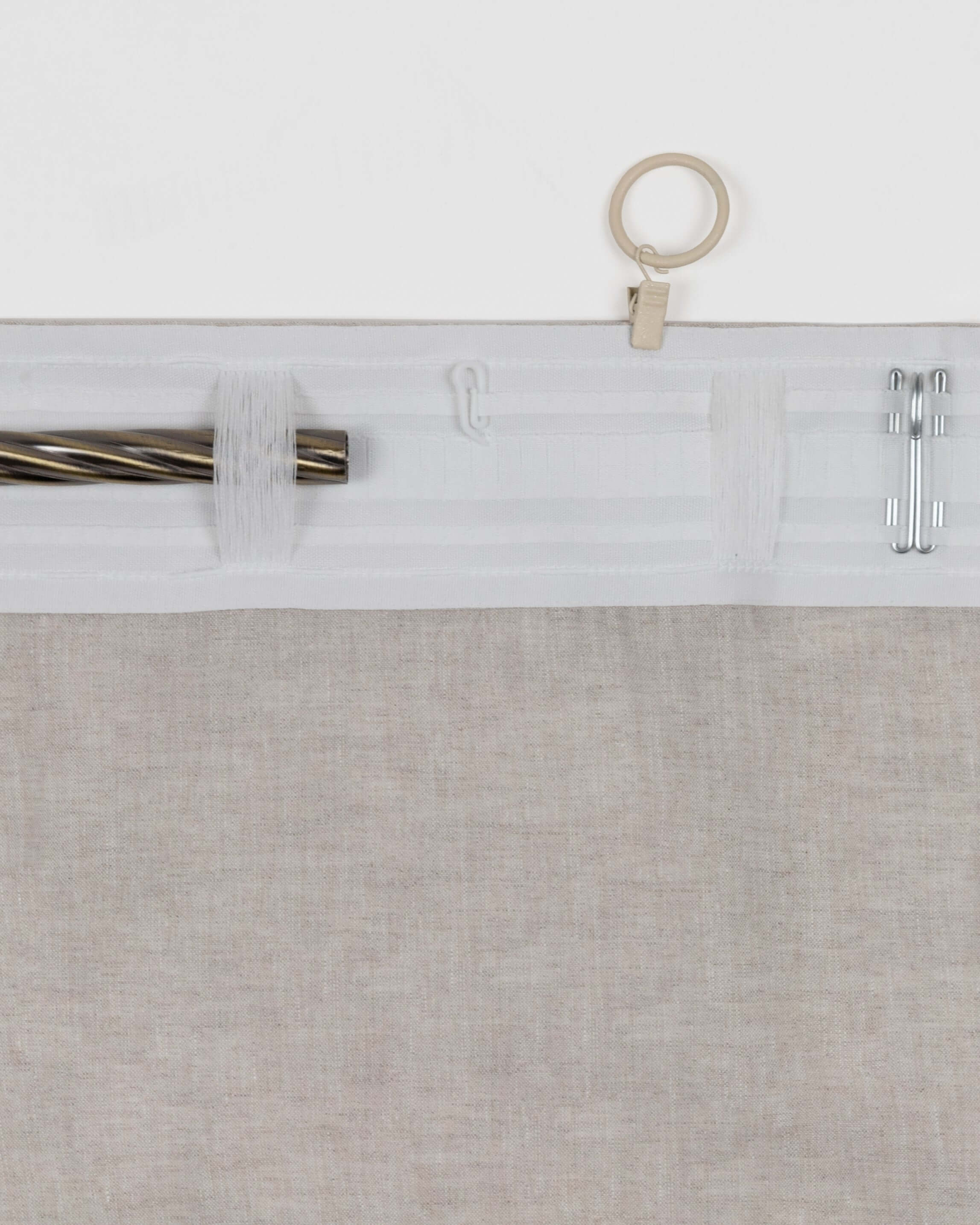 Close-up of linen curtain simple hem top finish with hanging rings